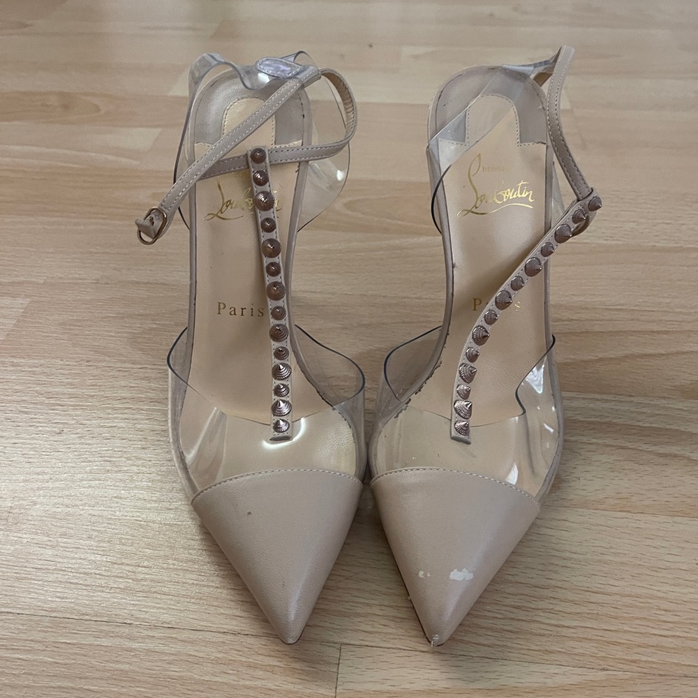 Nude + Acrylic Christian Louboutin T Strap Pumps with Rose Gold Spikes.